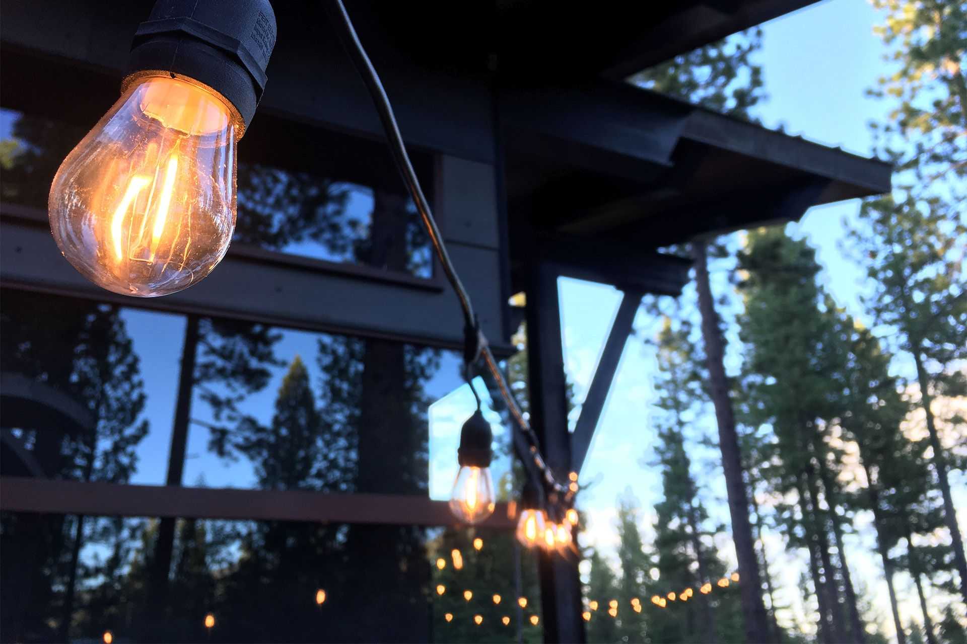 permanent bistro lighting hanging over a balcony in the Sierra Nevada