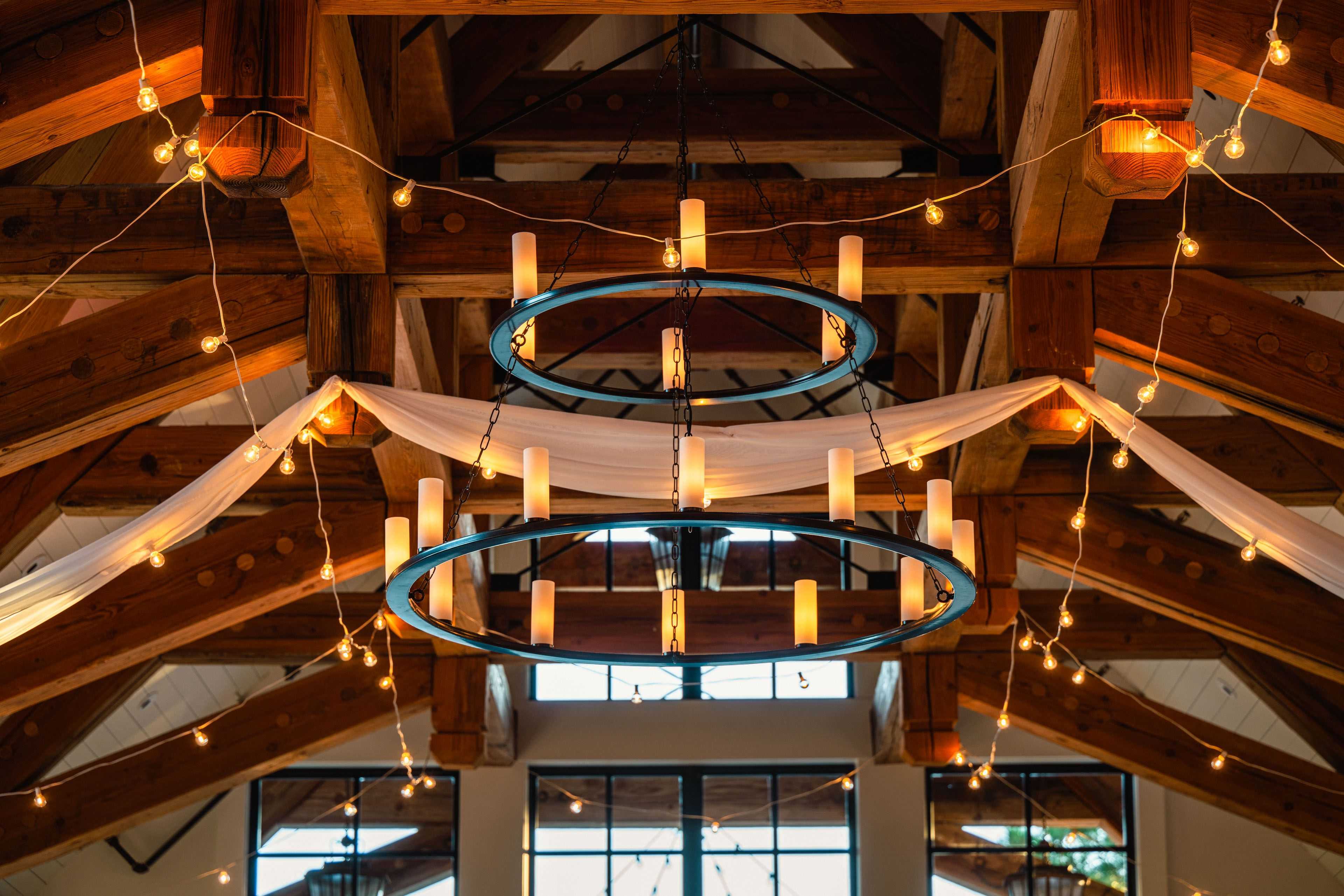market lights and wedding drapery hanging in the ceiling