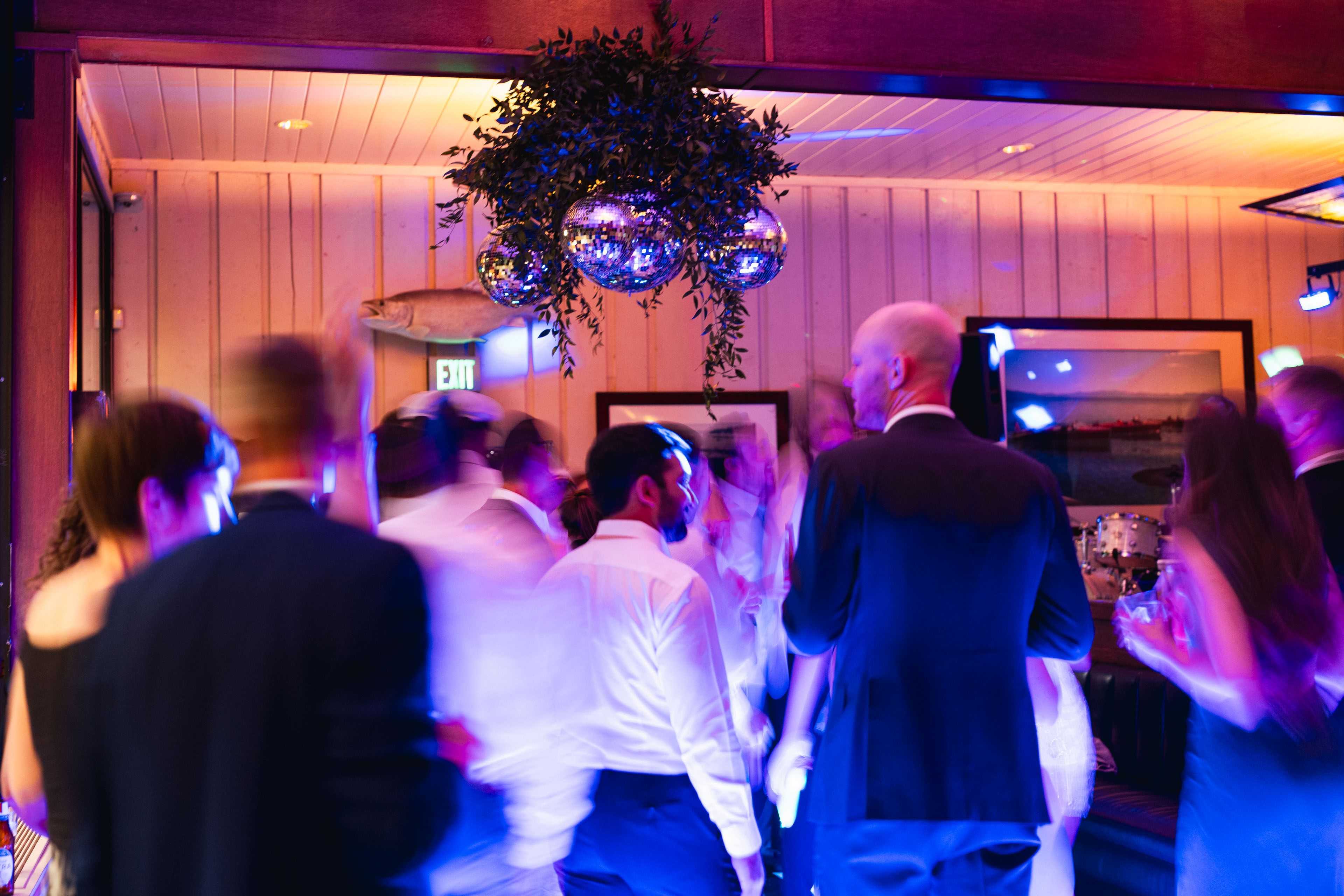 a disco dream chandelier above a Tahoe wedding dance party