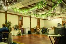 wedding reception with Sierra lighting hanging lighting over the ball room