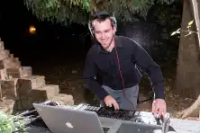 DJ working the decks at a wedding reception