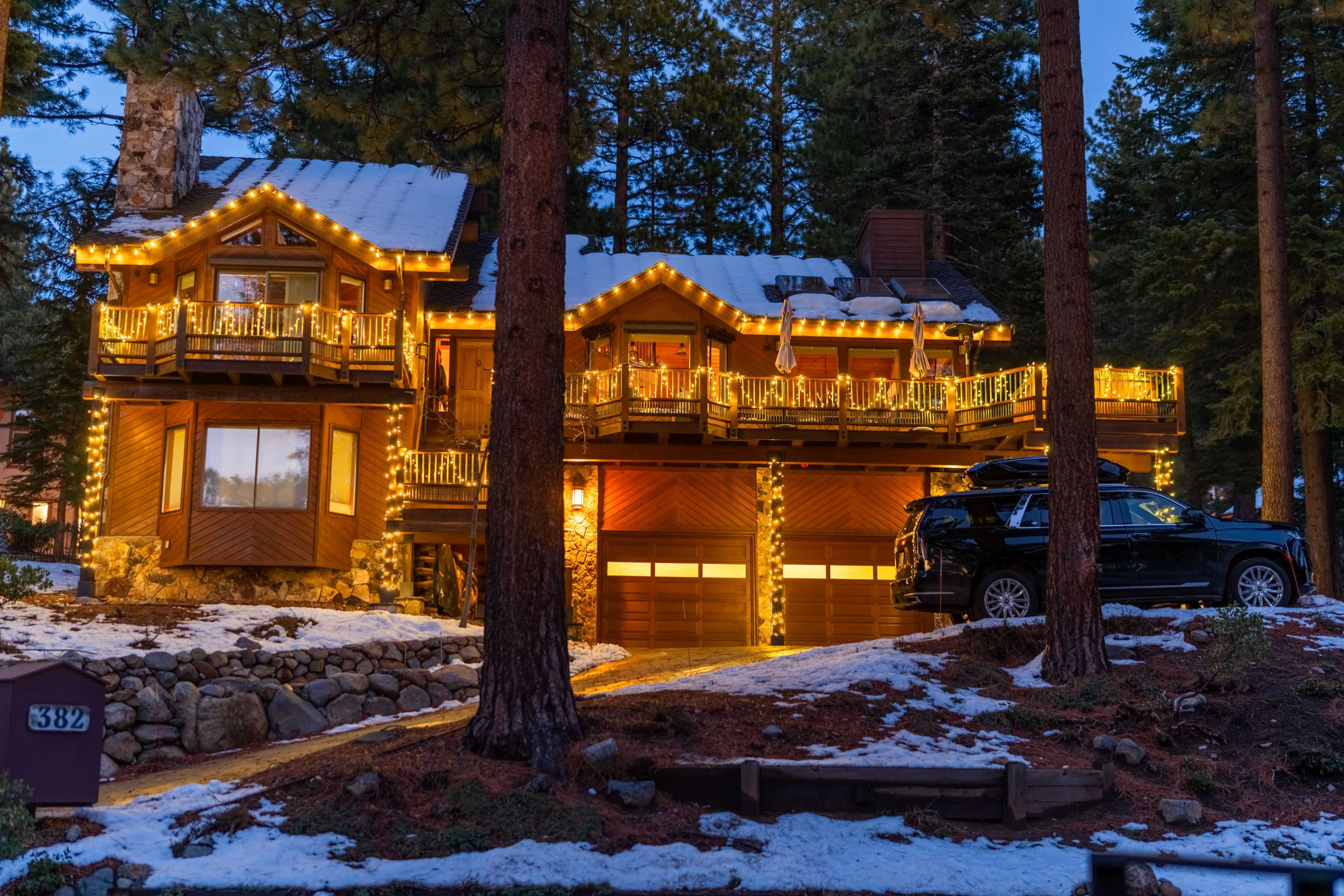 a home in incline village wrapped in holiday lighting