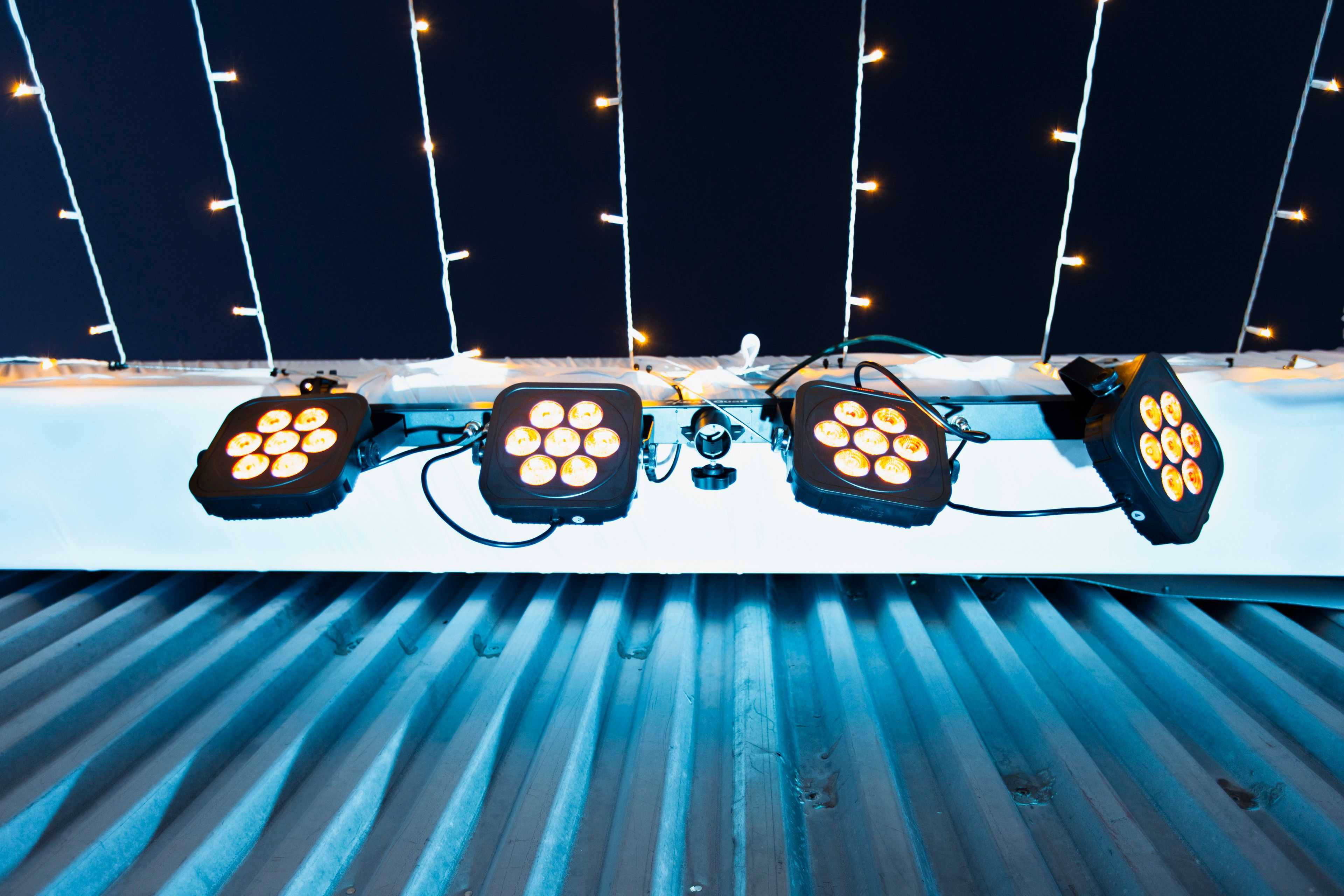 close up of dance floor lighting mounted to a metal barn