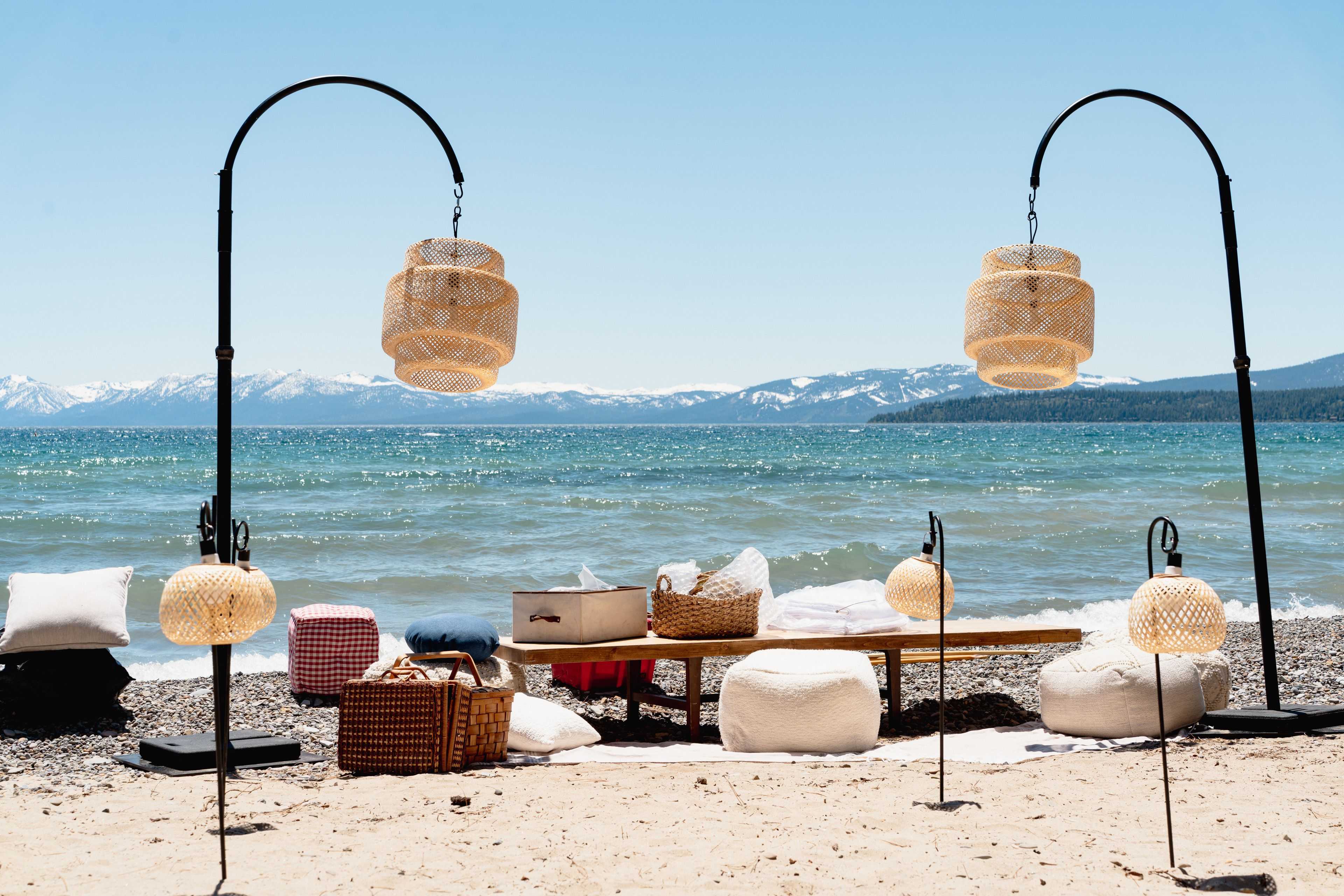 rattan lanterns hanging over a wedding scene on the shore of Lake Tahoe