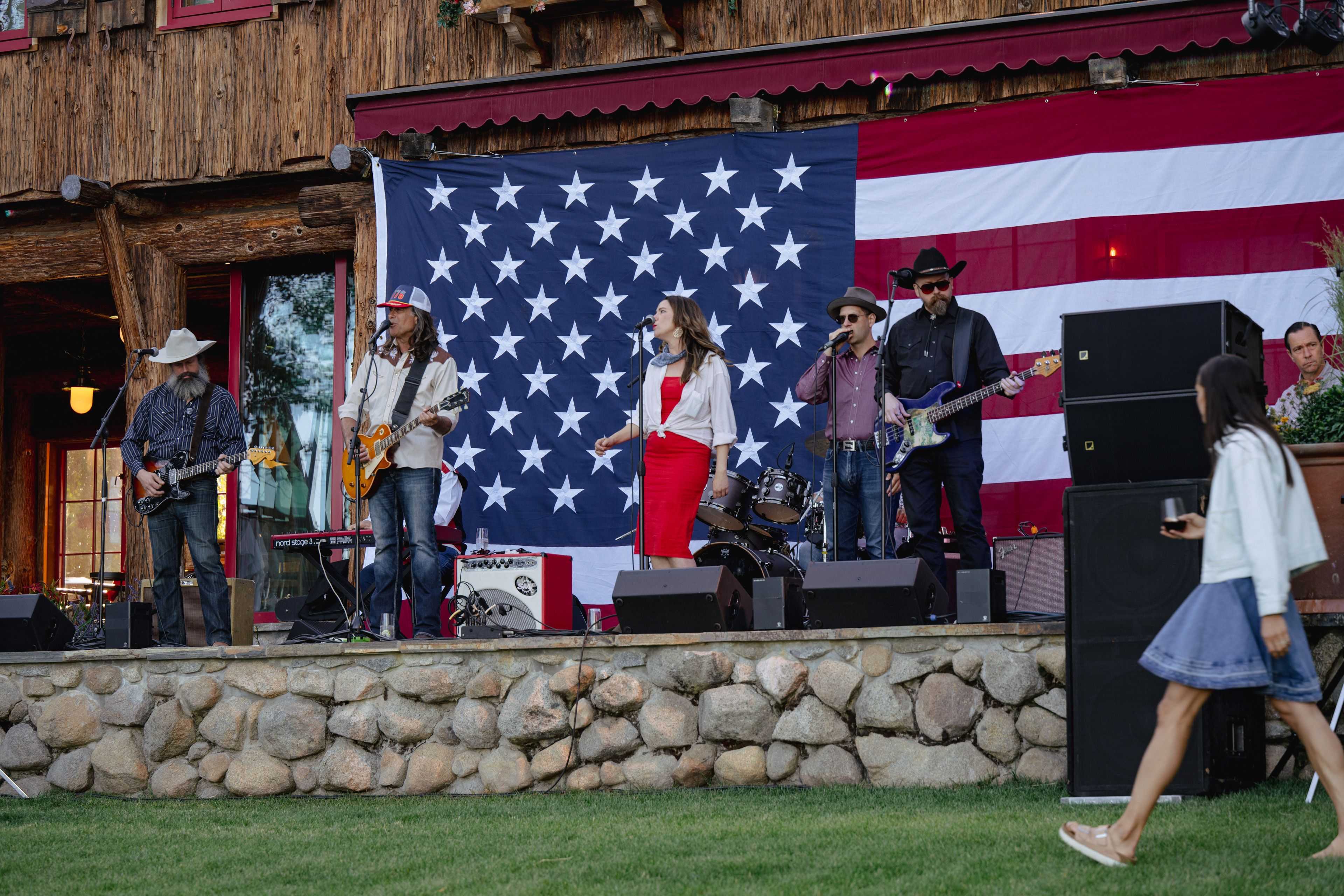 american flag hung behind a band