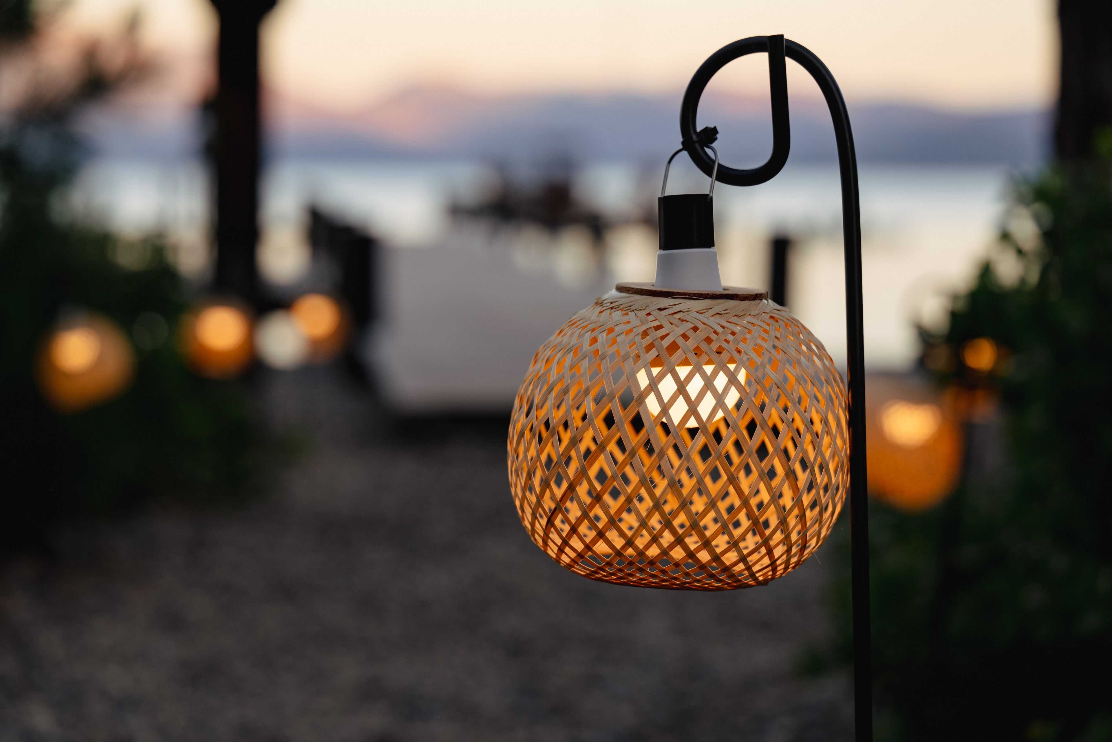 mini rattan lantern hanging from a hook