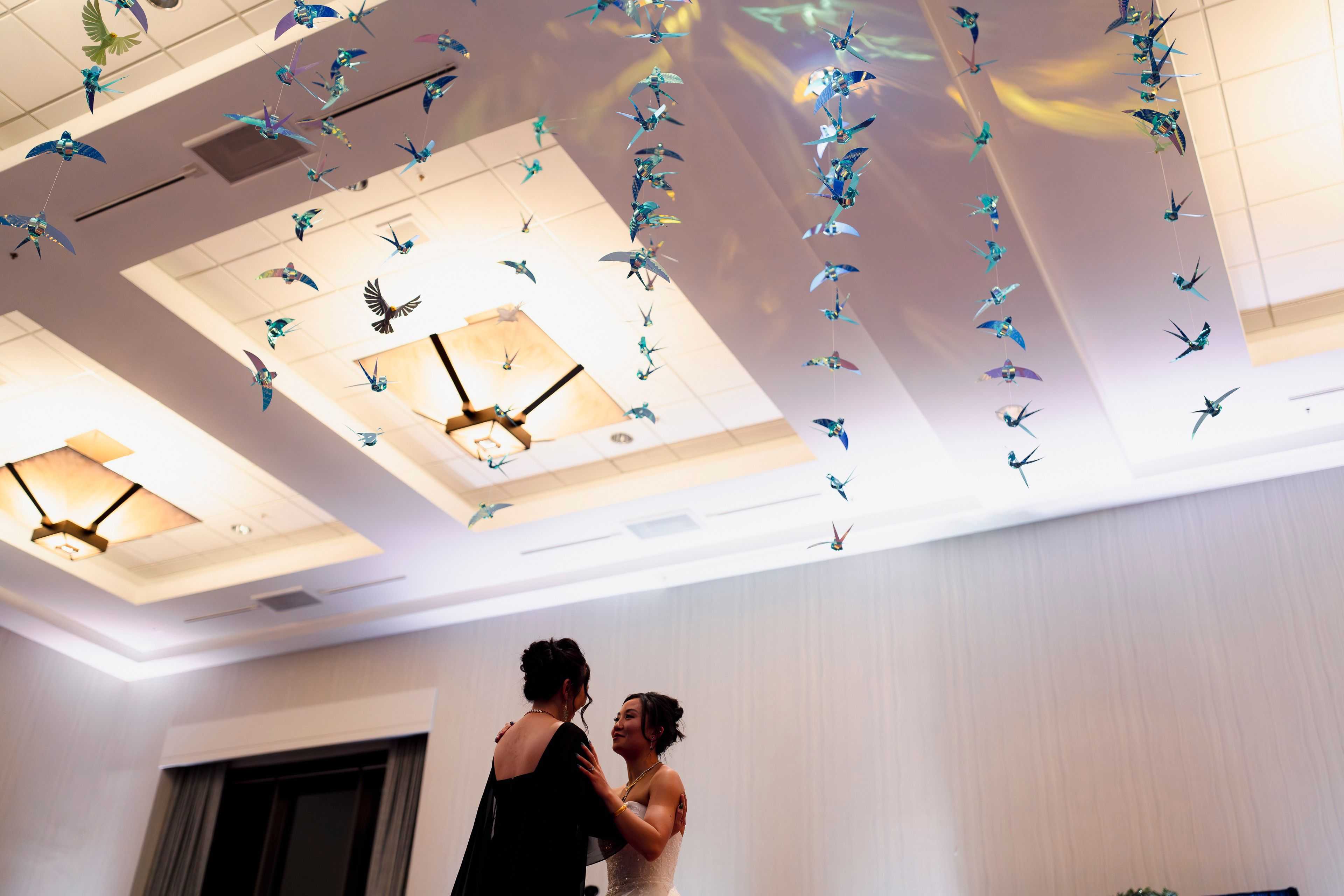 shimmer birds hanging above a mother daughter dance