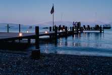a pier with lanterns on Lake Tahoe