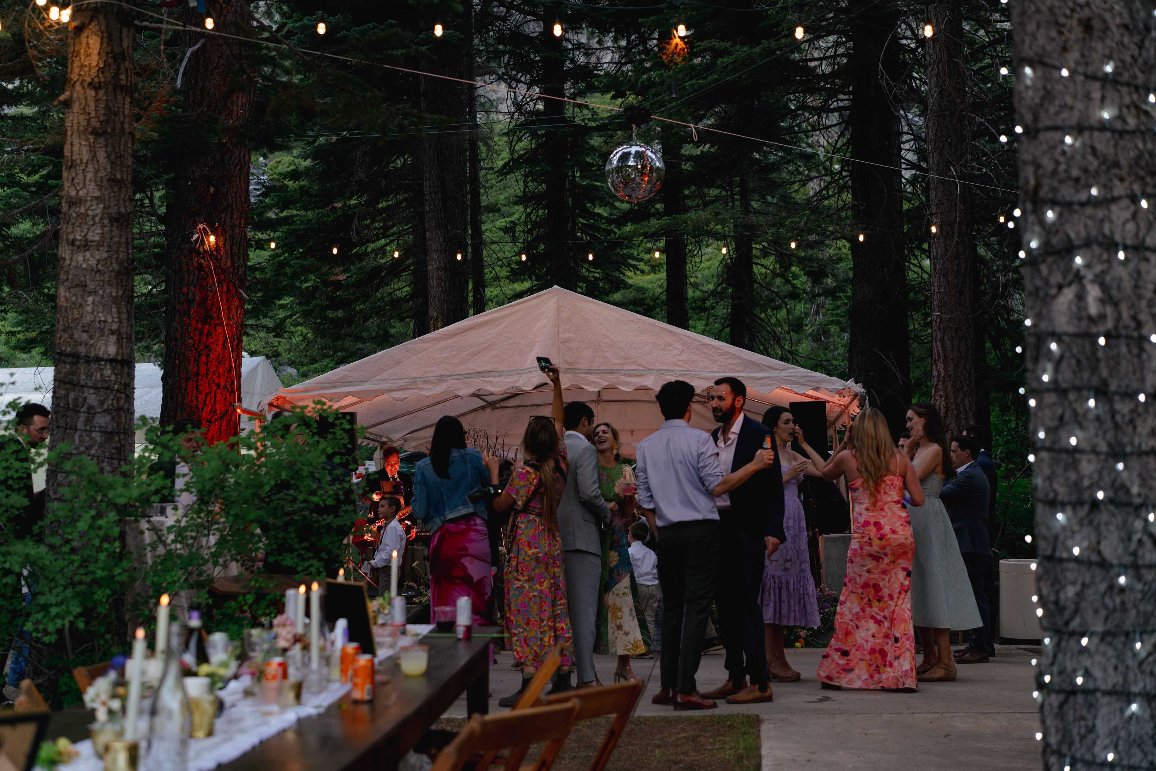 wedding guests enjoying the dance floor with disco ball