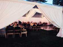 wedding tent wrapped in white drapery