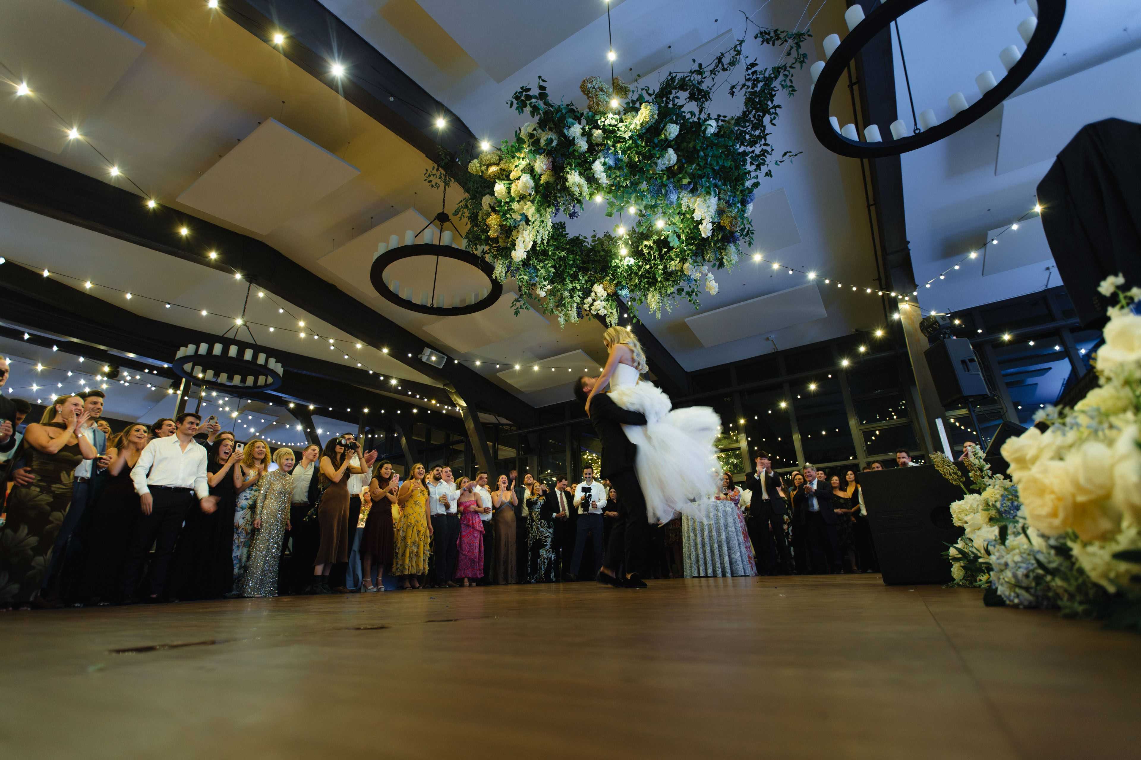 floral rigging above a wedding couple during a first dance