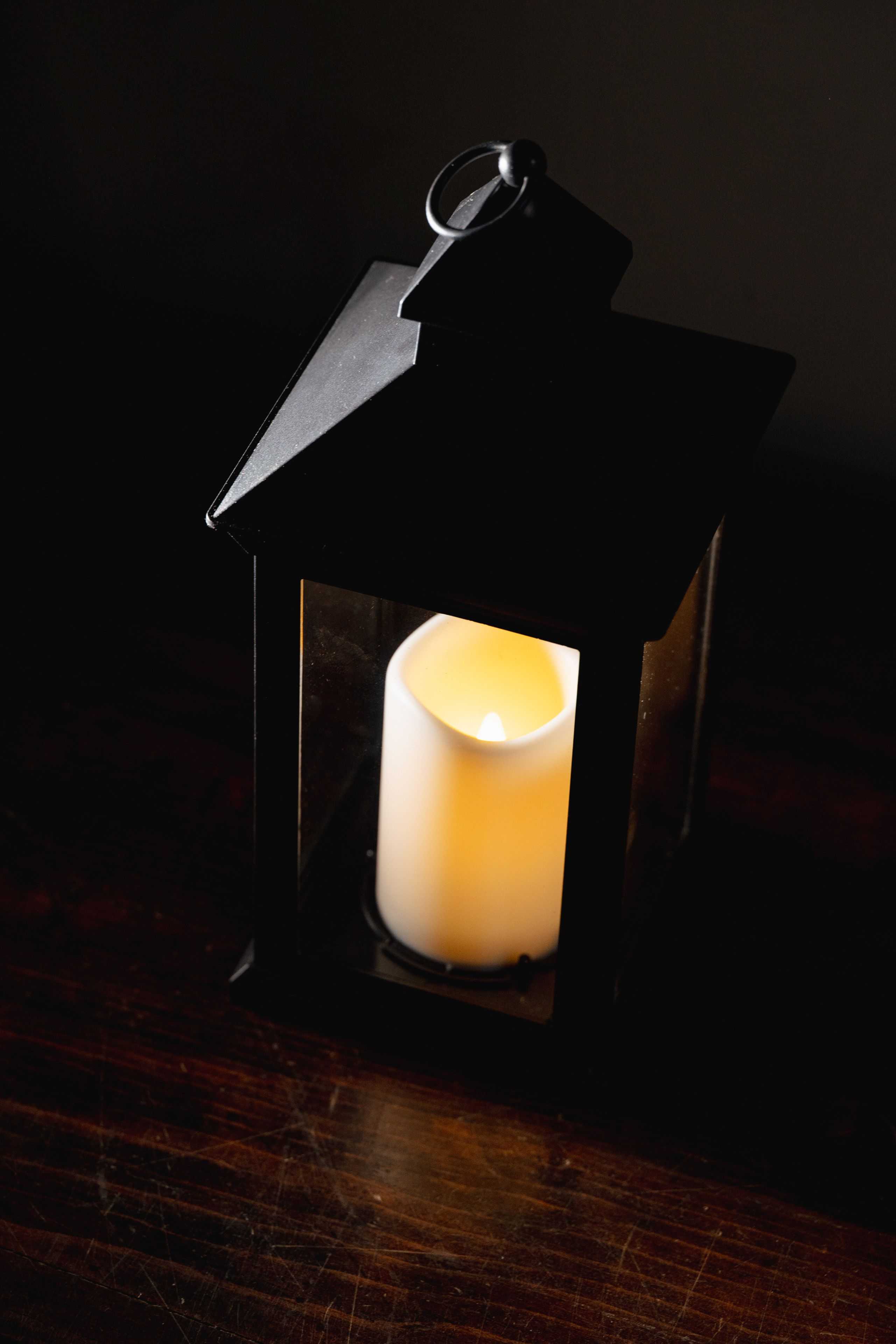 traditional lantern sitting on a wooden desk