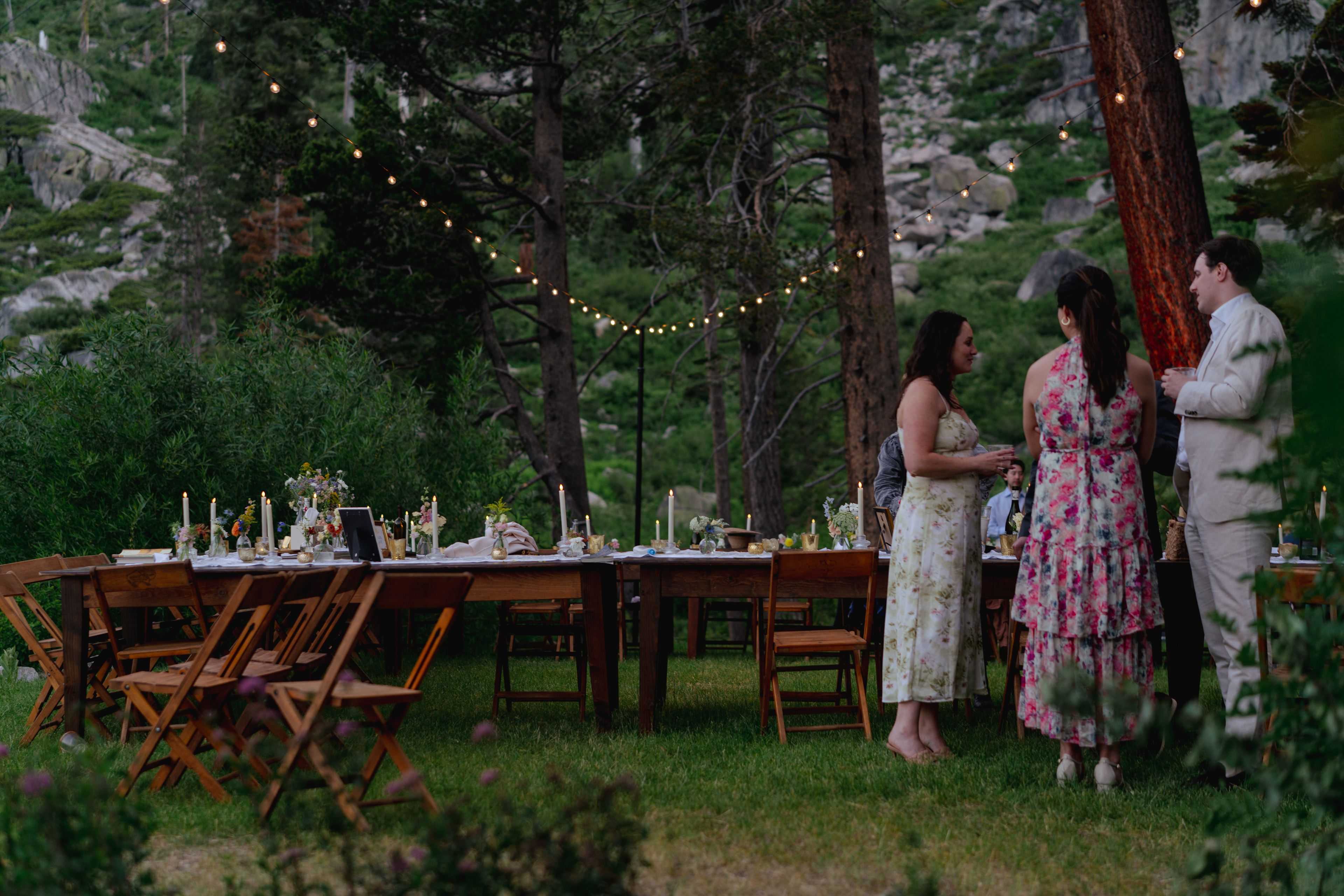 wedding guests enjoying market lights over the reception area