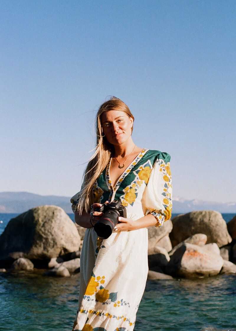 wedding photographer working bu the edge of Lake Tahoe