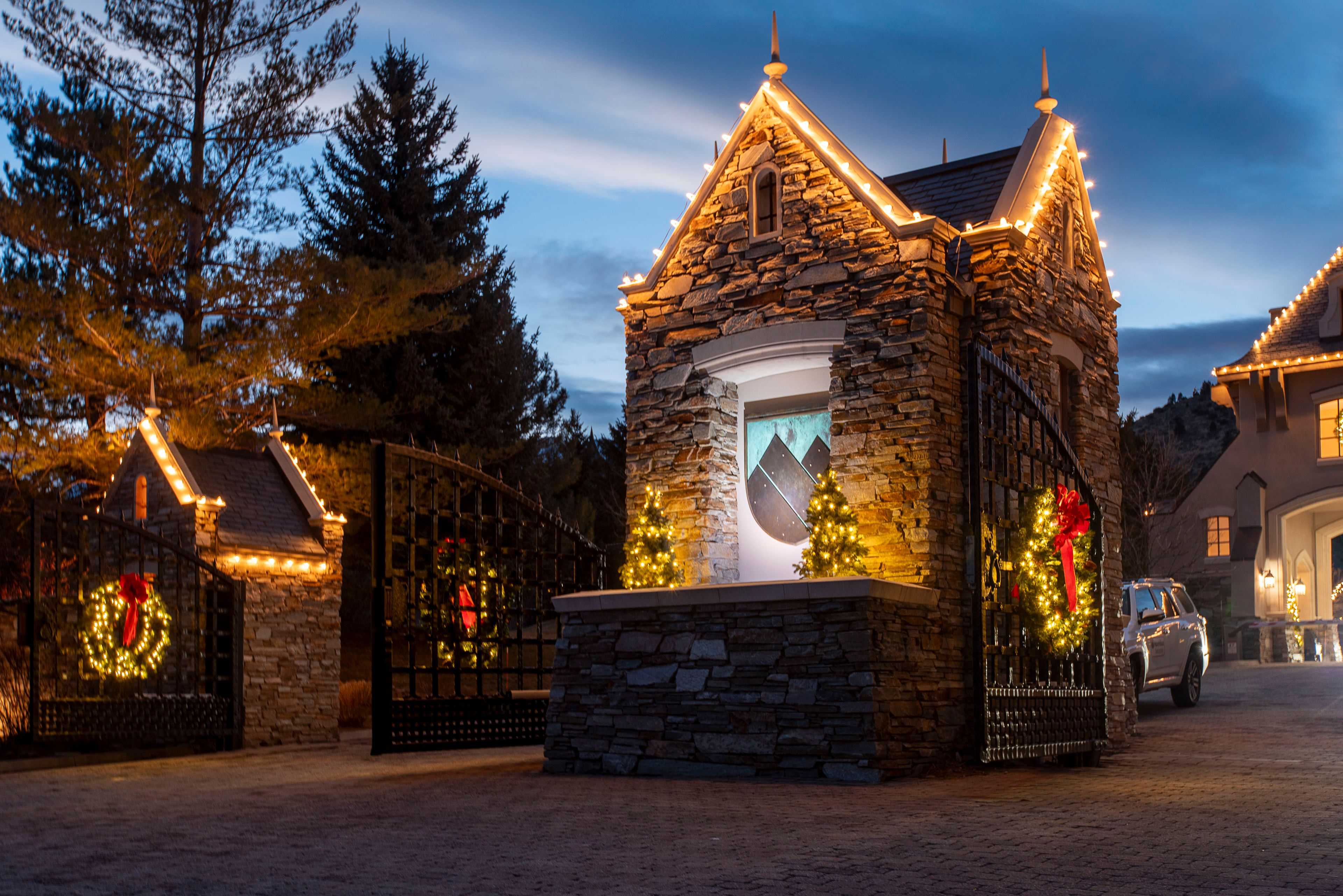 the entrance to montreaux with Christmas lights and wreaths on the gates