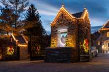 the entrance to montreaux with Christmas lights and wreaths on the gates