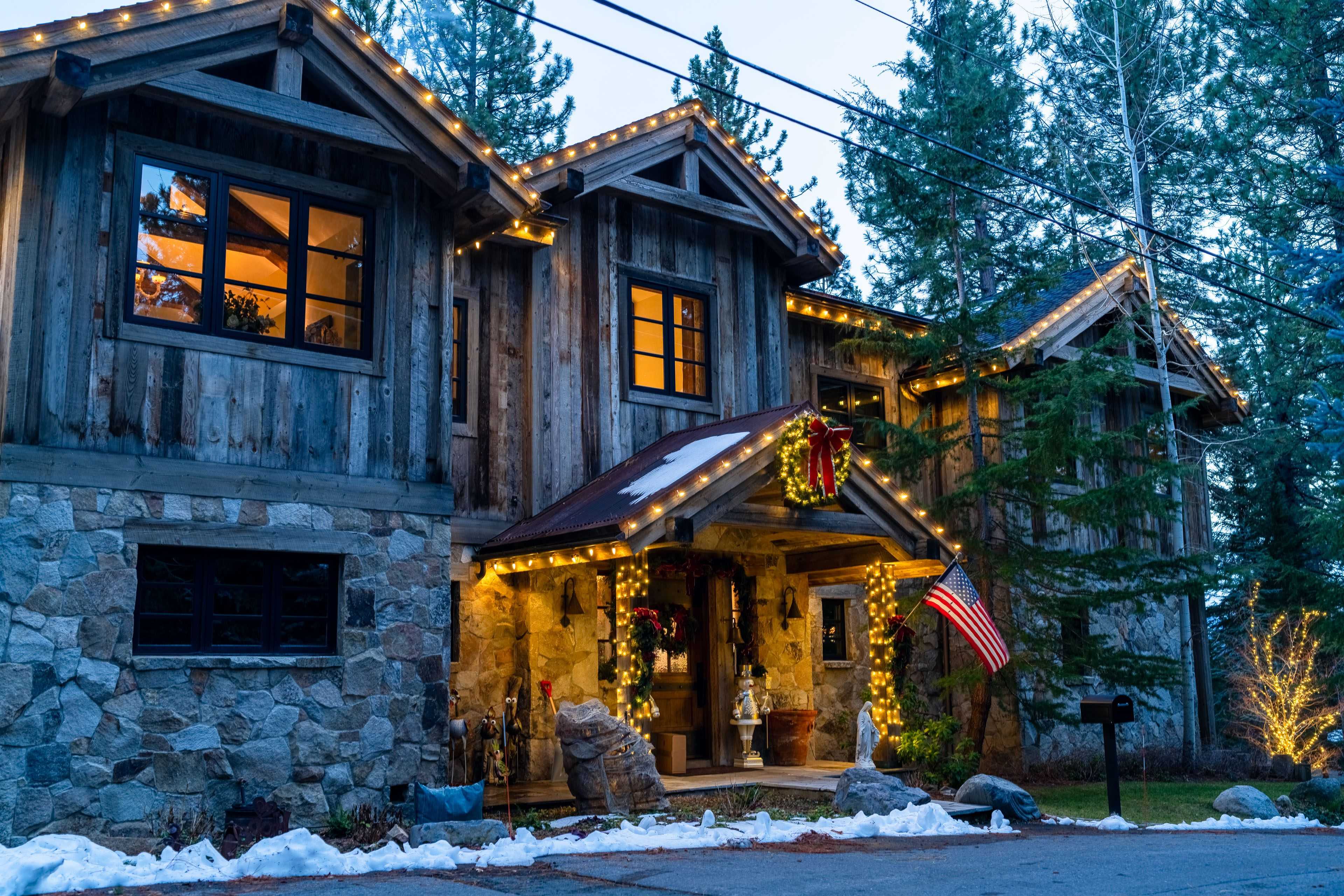 holiday lighting on a stately home