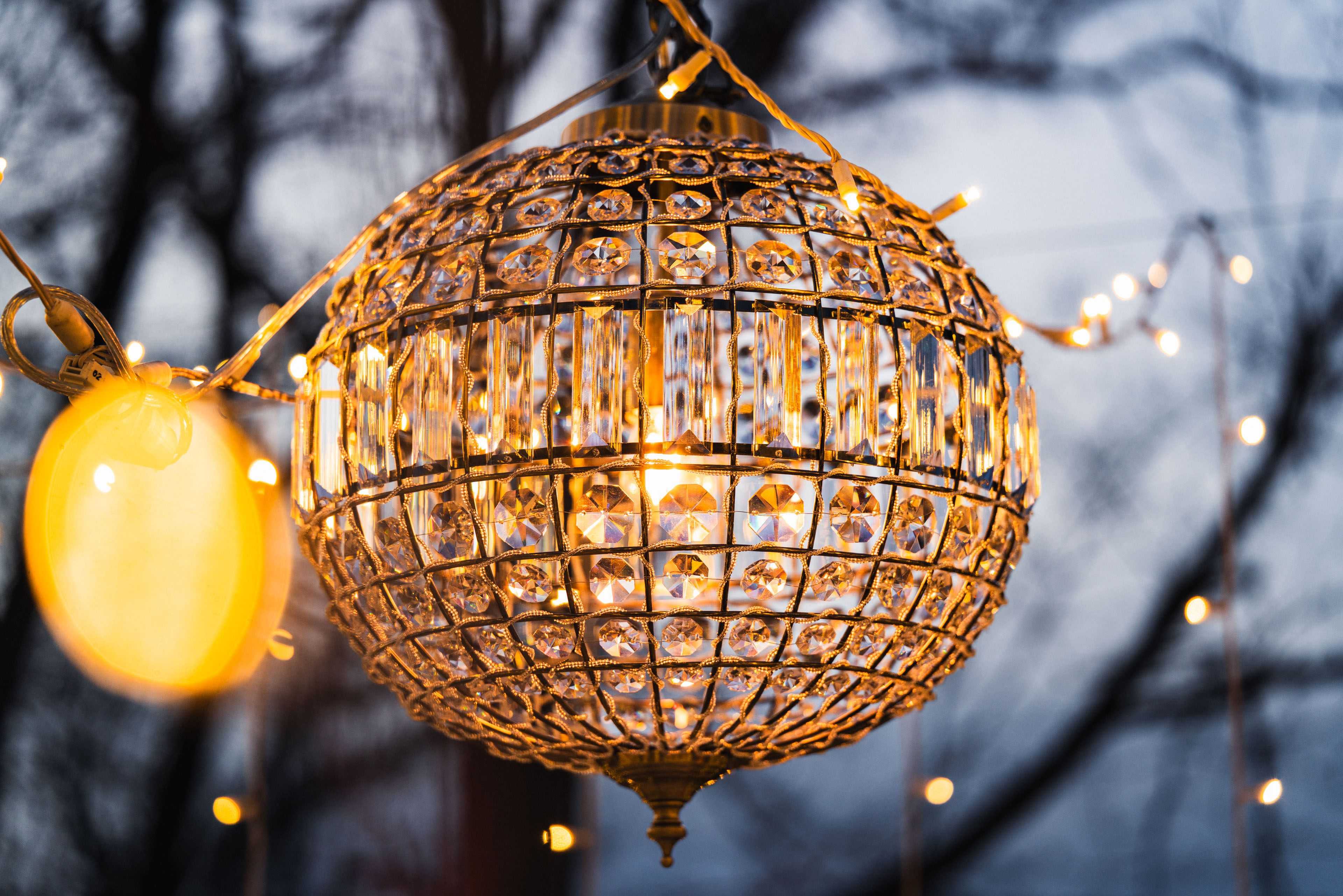 chandeliers hanging between mini lights