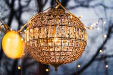 chandeliers hanging between mini lights