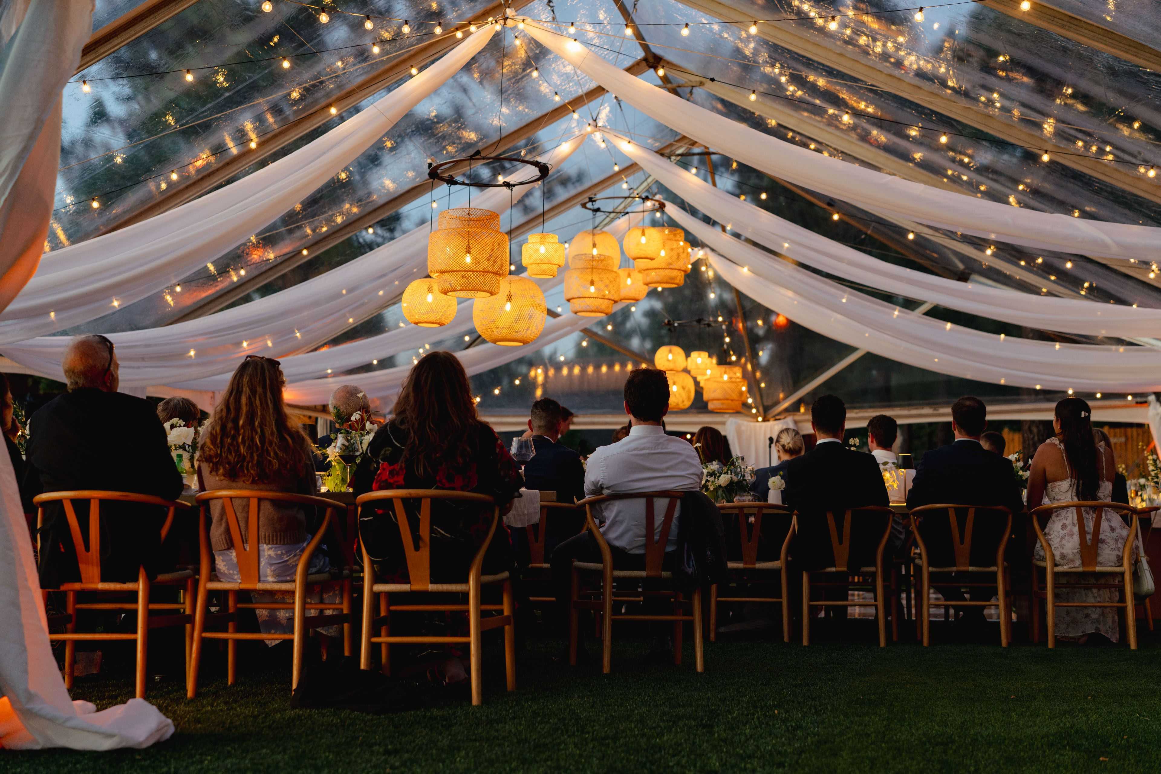 rattan lanterns and drapery in a wedding tent