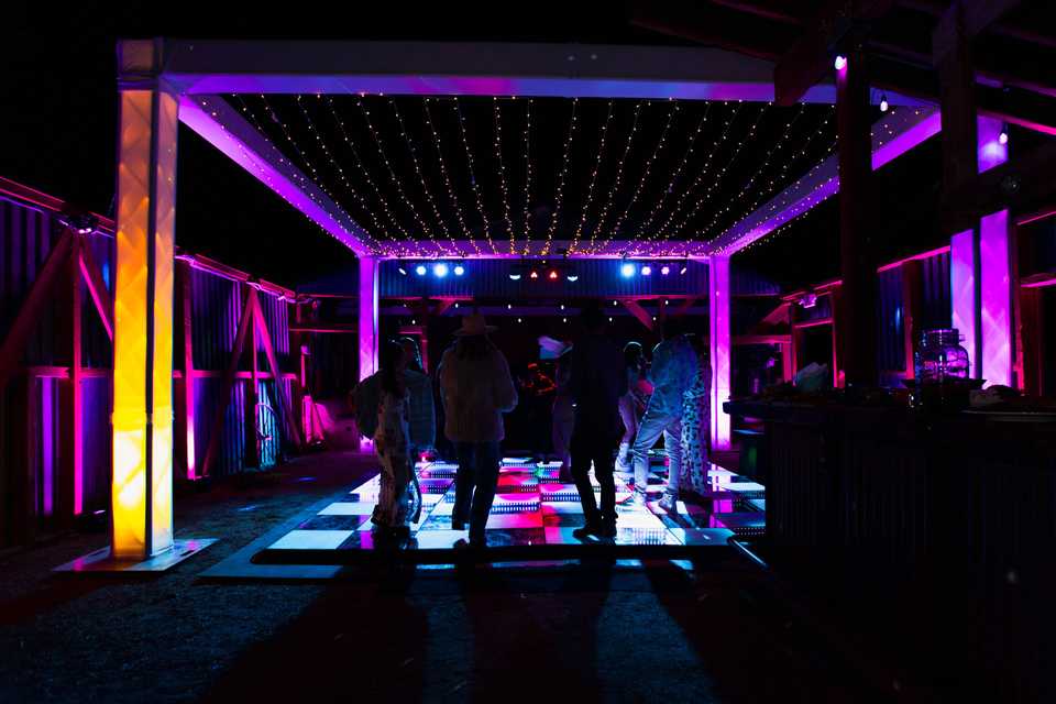 dance floor with a multi colored cube surround at night