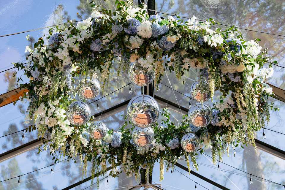 disco ball chandelier in a wedding tent
