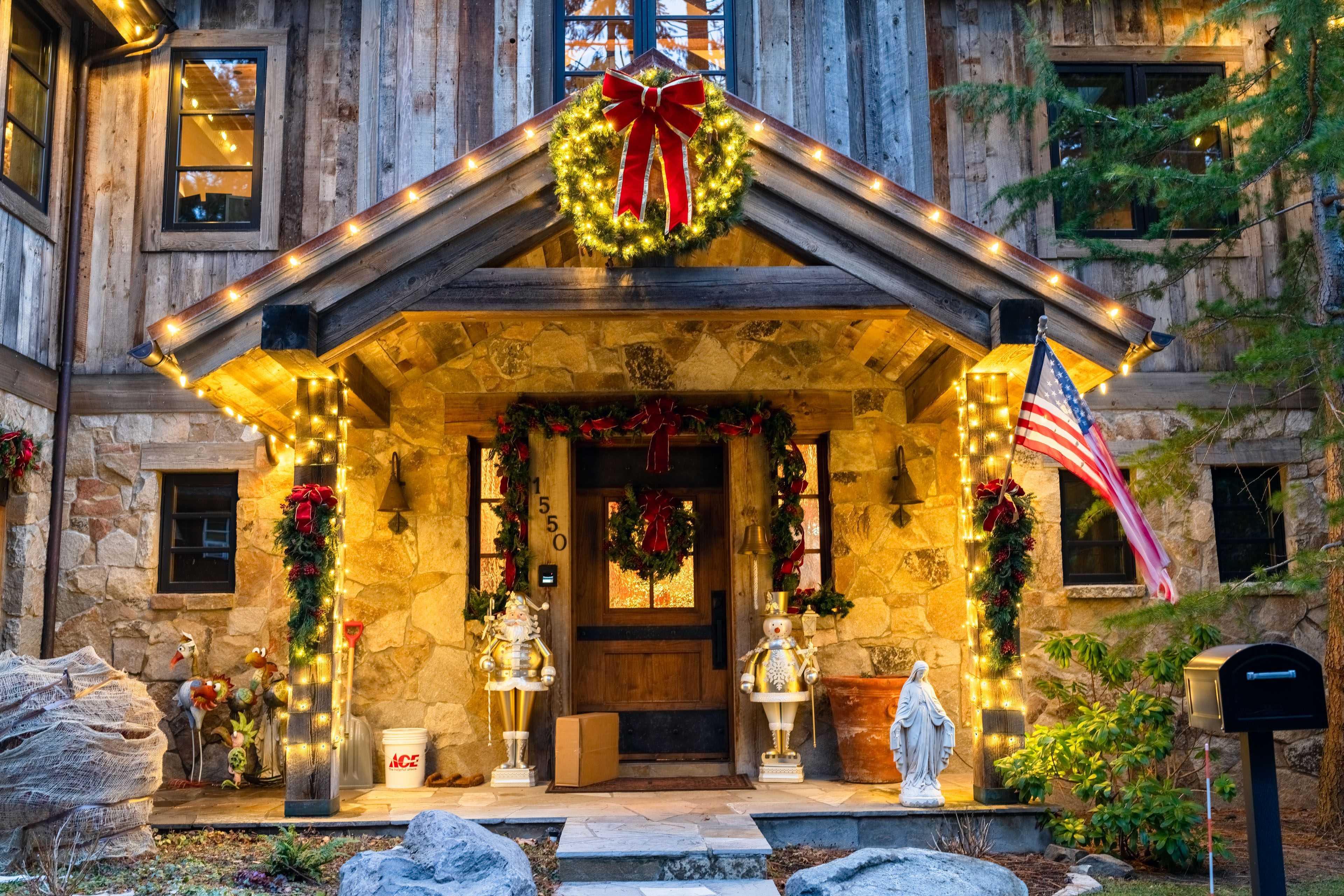 an entranceway to stately home in incline village wrapped in holiday lights