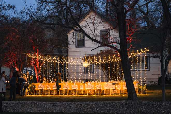 the venue at meadow view with a wedding table in front of the farm house
