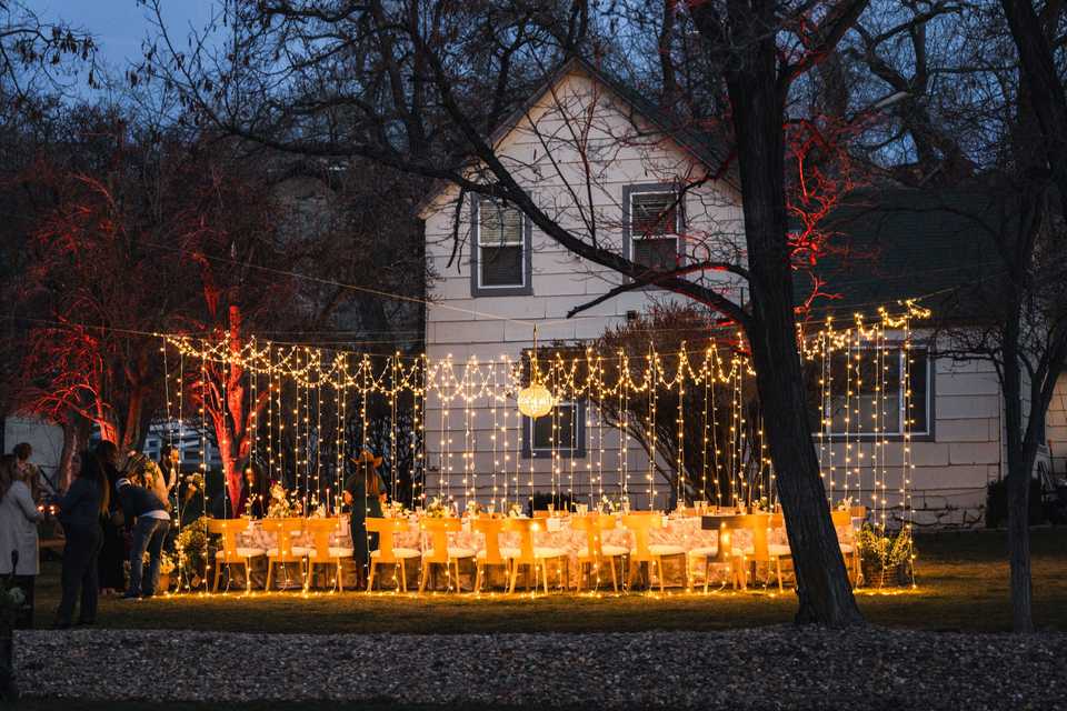 the venue at meadow view with a wedding table in front of the farm house