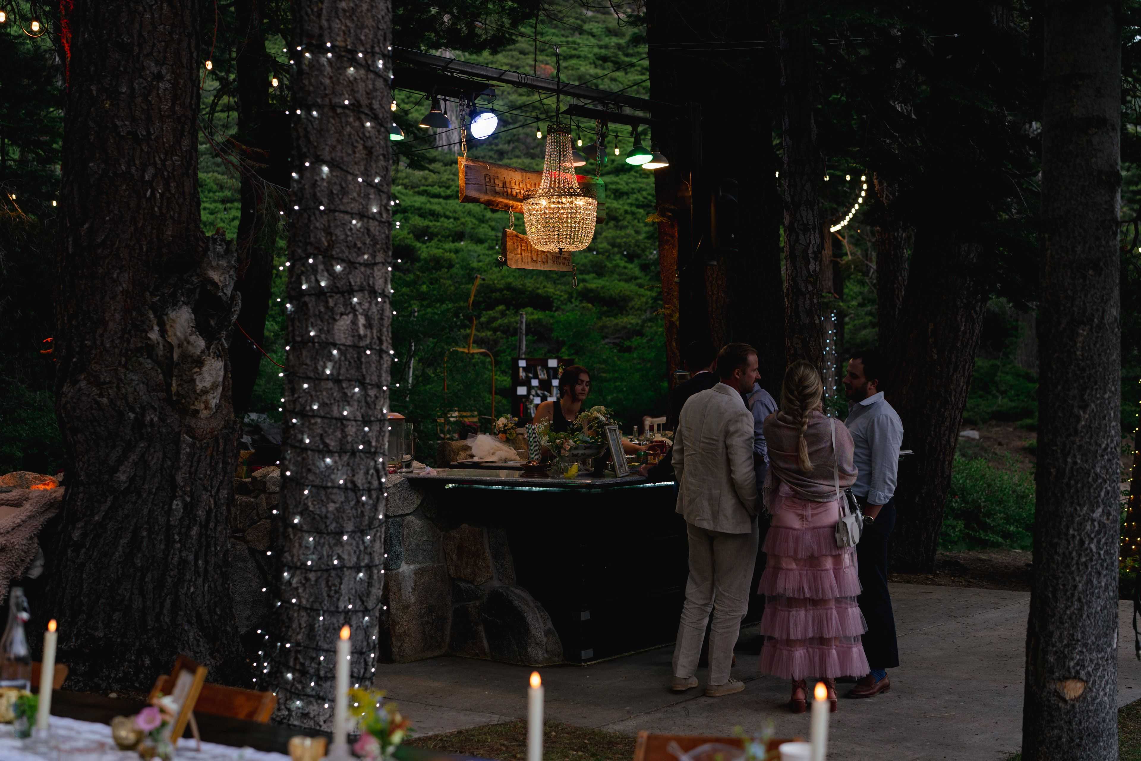 emperor chandelier hanging over the bar at white wolf tahoe wedding venue