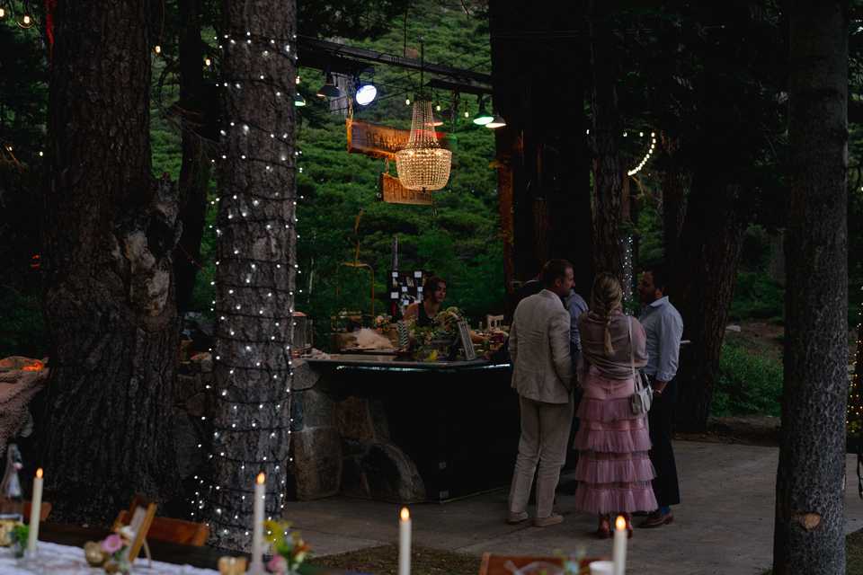 emperor chandelier hanging over the bar at white wolf tahoe wedding venue