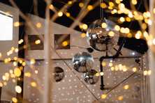 disco balls hanging over a corporate holiday party