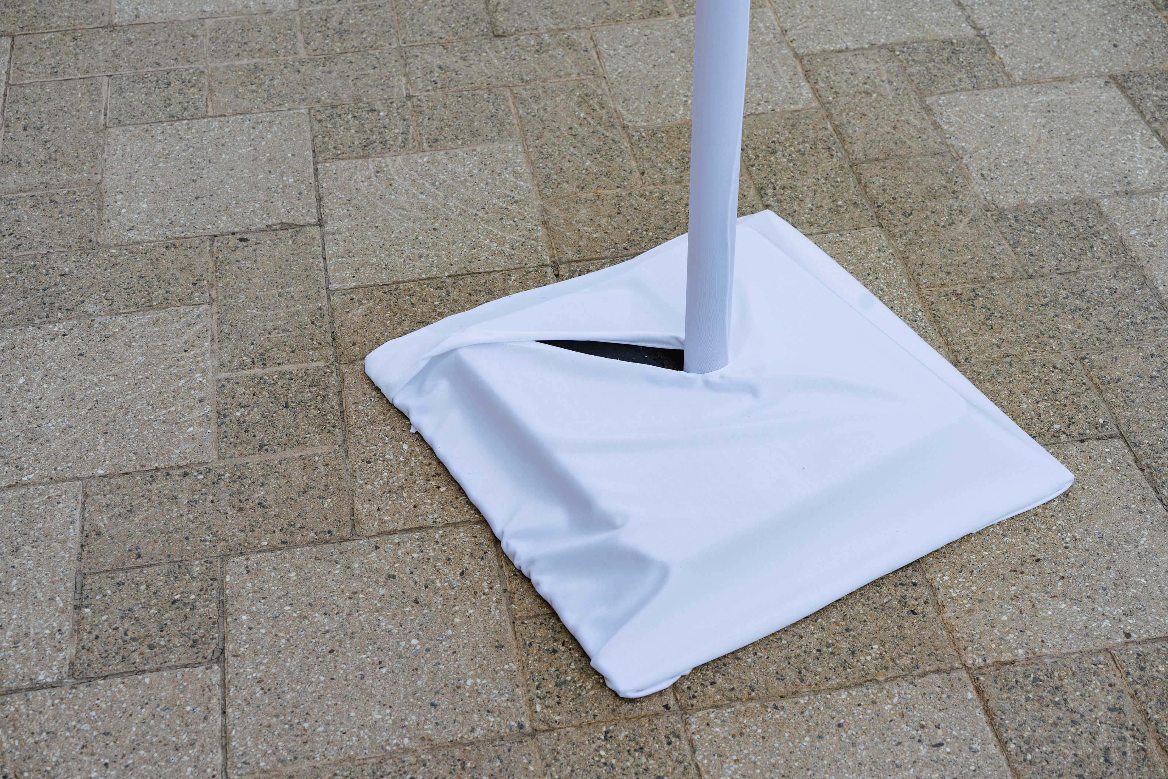 White Market light base cover on concrete