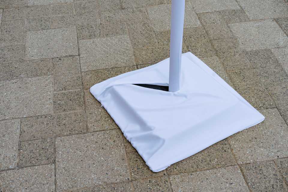 White Market light base cover on concrete