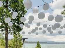 paper lantern clouds with market lights over Lake Tahoe