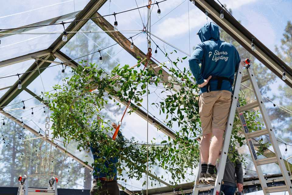 the Sierra lighting team working in a tent