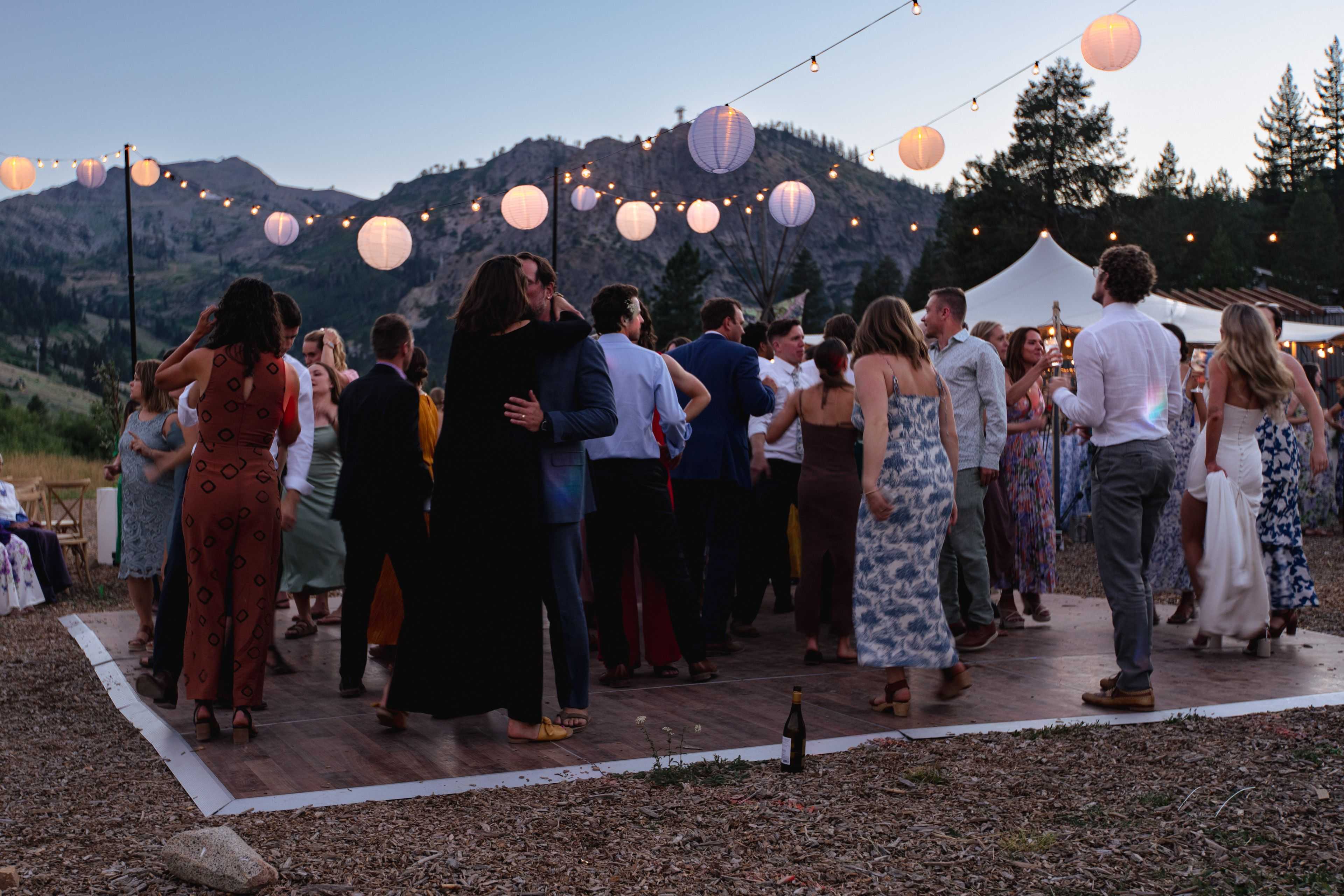 paper lanterns above the dance floor of a wedding held at the Olympic Valley stables